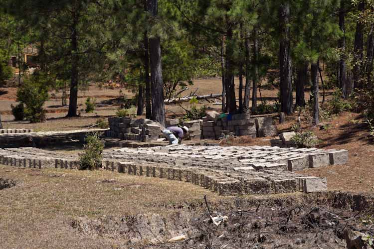 Producing mud bricks